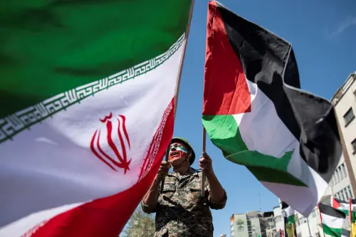 With his face painted in the colors of the Iranian flag, a man chants slogans as he waves the Iranian and Palestinian flags in the annual rally to mark Quds Day, or Jerusalem Day, in support of Palestinians, in Tehran, Iran, Friday, April 5, 2024.