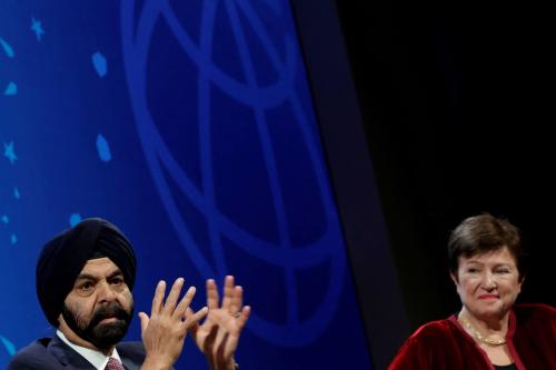 Ajay Banga and Kristalina Georgieva speak in front of a backdrop with the World Bank logo