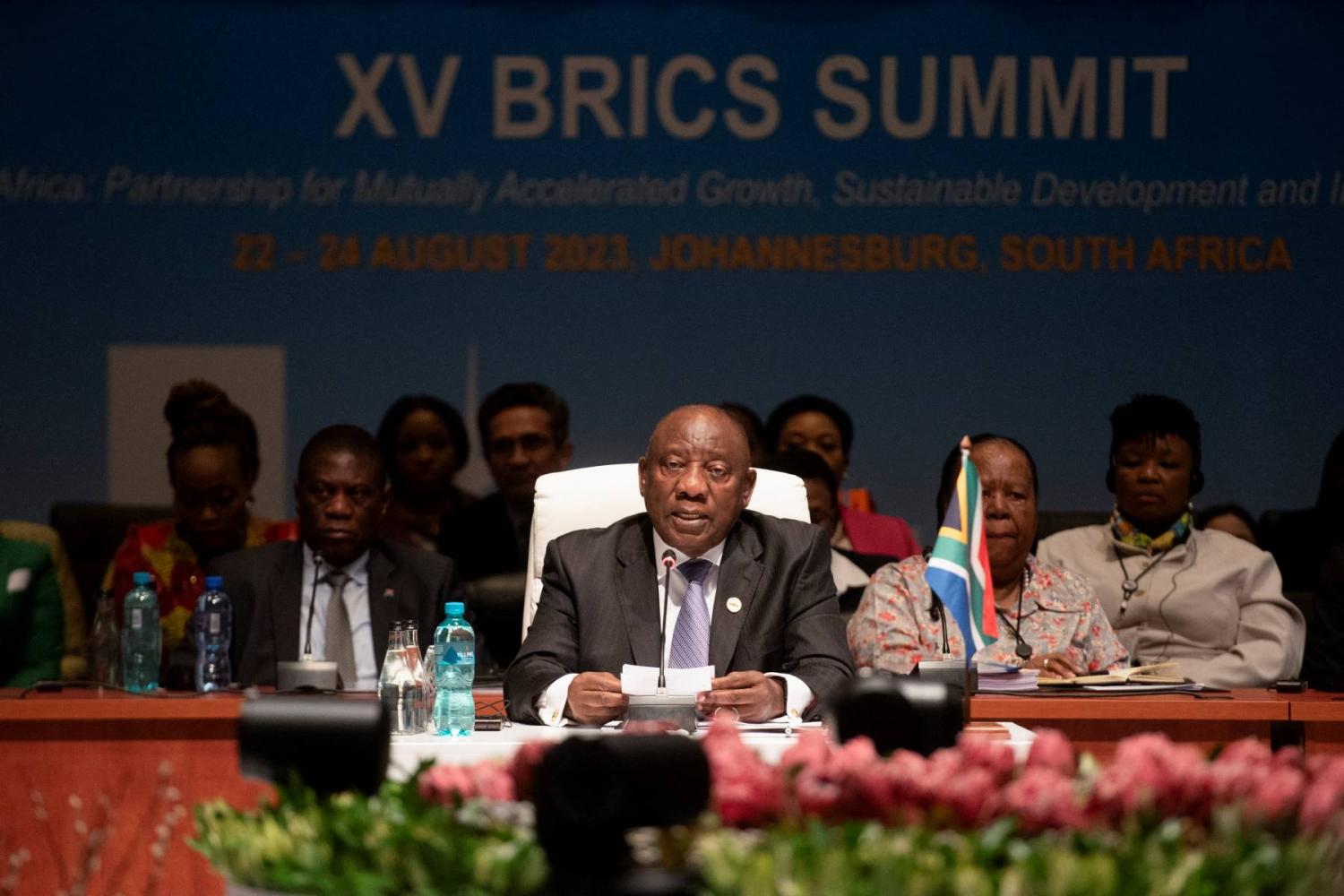 President Ramaphosa sits at a table