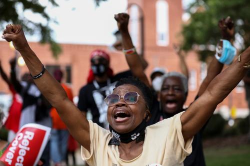 Tyrrah Young Mwanga reacts as Black Voters Matter co-founders Cliff Albright and LaTosha Brown speak during a stop on the Freedom Ride For Voting Rights at Ebenezer Baptist Church in Atlanta, Georgia, U.S. June 21, 2021.