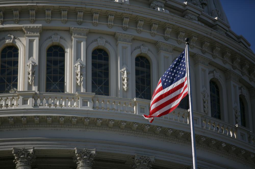 The American flag waves outside of the U.S. Capitol in Washington, D.C. on January 5, 2023 during the 'Jan 6 Justice: Democracy on the Line' rally and press conference, demanding accountability for former President Donald Trump and other officials for the January 6, 2021 Capitol riot, as well as for safe and fair elections.