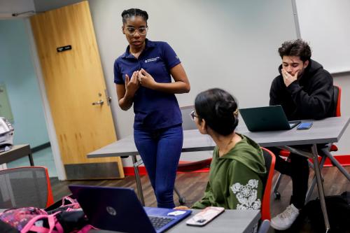 ZaQuela Taylor, the assistant director of student services at the University of Illinois at Chicago, left, assists UIC freshman Krina Patel during a FAFSA workshop on Feb. 23, 2024, at the Student Financial Aid Office at UIC.