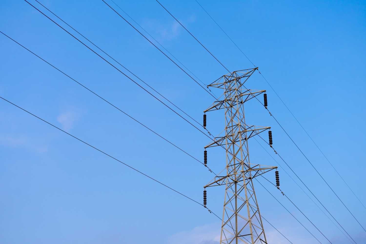 Power lines representing the electric grid and clean energy transition