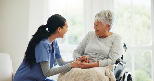 Nurse talking with an elderly patient