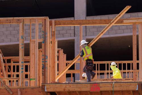 Construction employees work in a multifamily housing project in San Diego, California, U.S., September 19, 2023. REUTERS/Mike Blake