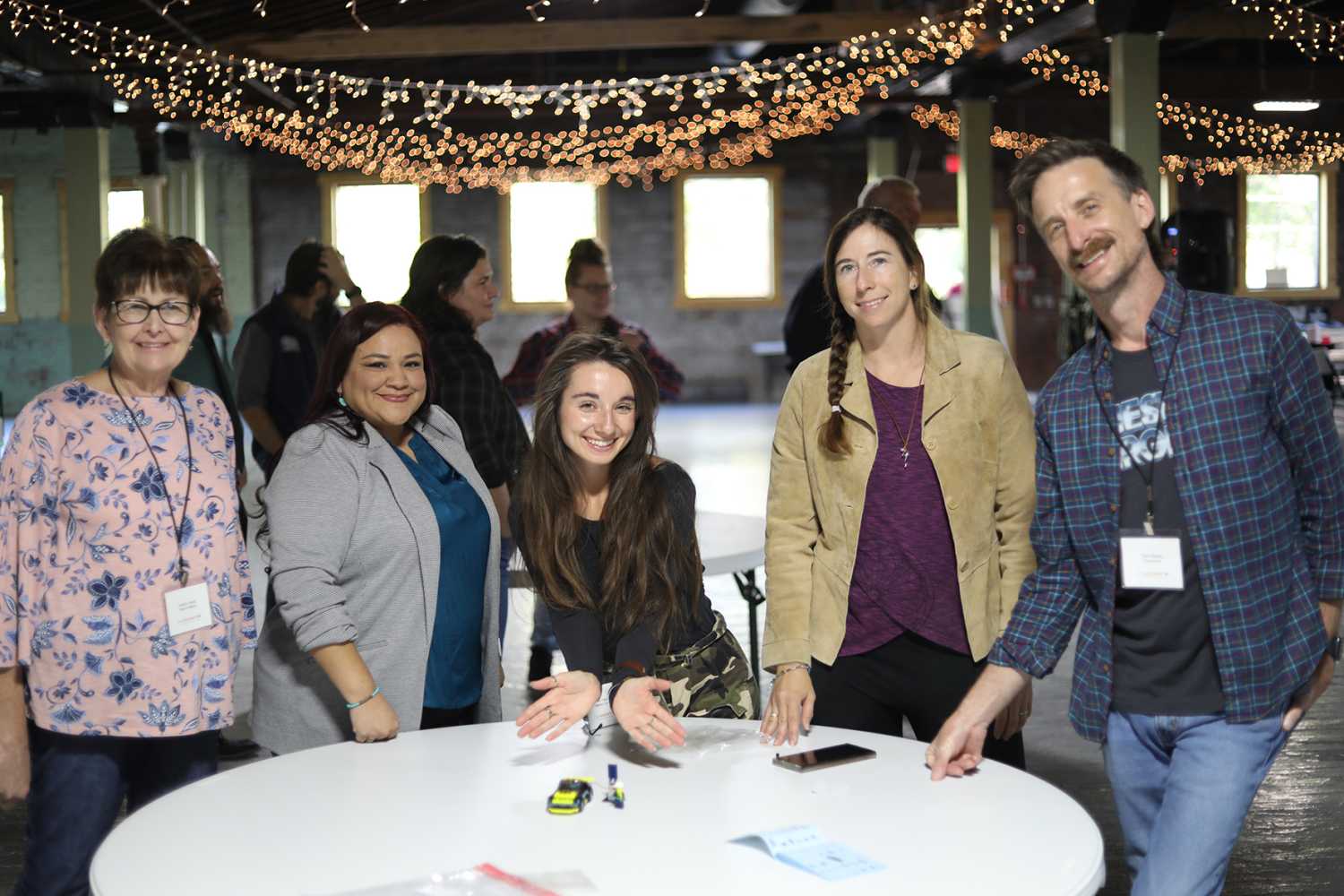 Prior to a presentation on microgrids, Accelerate WV group session participants from Town of Wayne, Webster County, Princeton, Ronceverte, and ProtoGen, Inc., compete in a Lego electric car building exercise. (Credit: Accelerate WV)