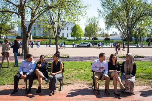 WASHINGTON DC - CIRCA APRIL 2015: Diverse, multicultural college students have a conversation outside the White House in Washington DC.