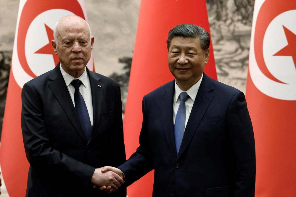 Tunisian President Kais Saied and Chinese President Xi Jinping shake hands following a signing ceremony at the Great Hall of the People in Beijing, China May 31, 2024.