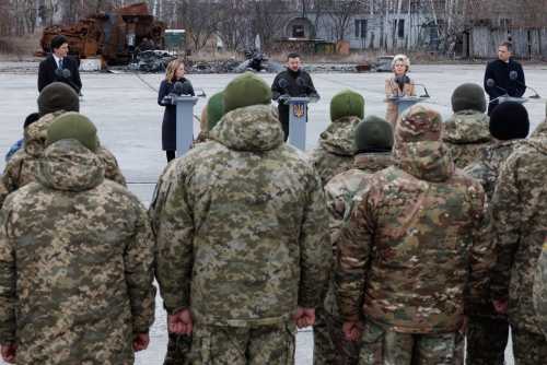 Prime Minister of Canada Justin Trudeau, Italian Prime Minister Giorgia Meloni, Ukraine president Volodymyr Zelensky, European Commission president Ursula Von der Leyen and Prime Minister Alexander De Croo pictured during a commemoration with the Defense Forces' military men who participated in the defense of the Antonov airport in Hostomelin, Ukraine, Saturday 24 February 2024.