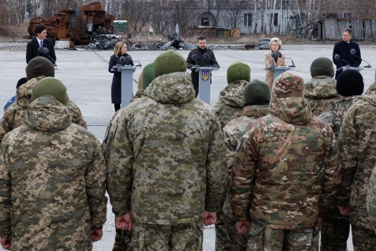 Prime Minister of Canada Justin Trudeau, Italian Prime Minister Giorgia Meloni, Ukraine president Volodymyr Zelensky, European Commission president Ursula Von der Leyen and Prime Minister Alexander De Croo pictured during a commemoration with the Defense Forces' military men who participated in the defense of the Antonov airport in Hostomelin, Ukraine, Saturday 24 February 2024.