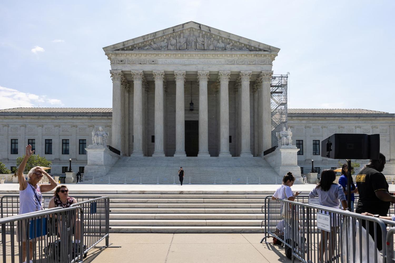 Demonstrators gather outside the U.S. Supreme Court as justices issue rulings in the cases of Fischer v. United States, Loper Bright Enterprises v. Raimondo, and City of Grants Pass v. Johnson, in Washington, U.S., June 28, 2024.