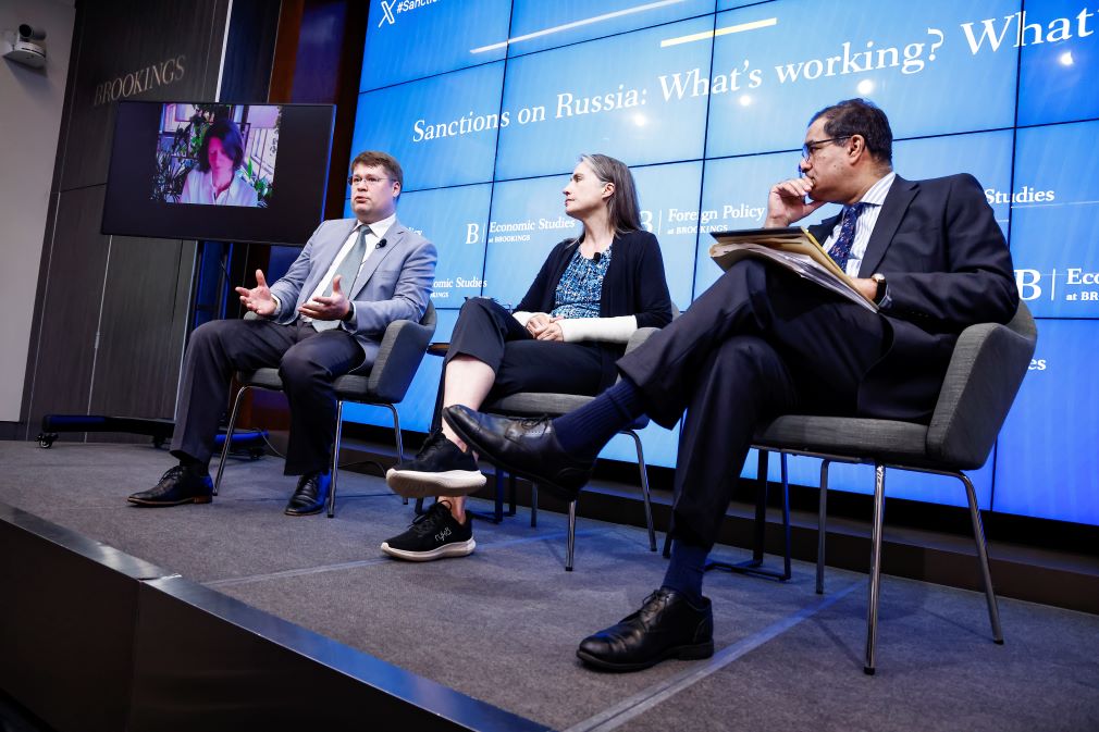 Agathe Demarais of the European Council on Foreign Relations, Yuriy Gorodnichenko of the University of California-Berkeley, and Brookings Senior Fellow Fiona Hill discuss sanctions during the panel, moderated by Reuters Diplomatic Correspondent Arshad Mohammed. / The Brookings Institution