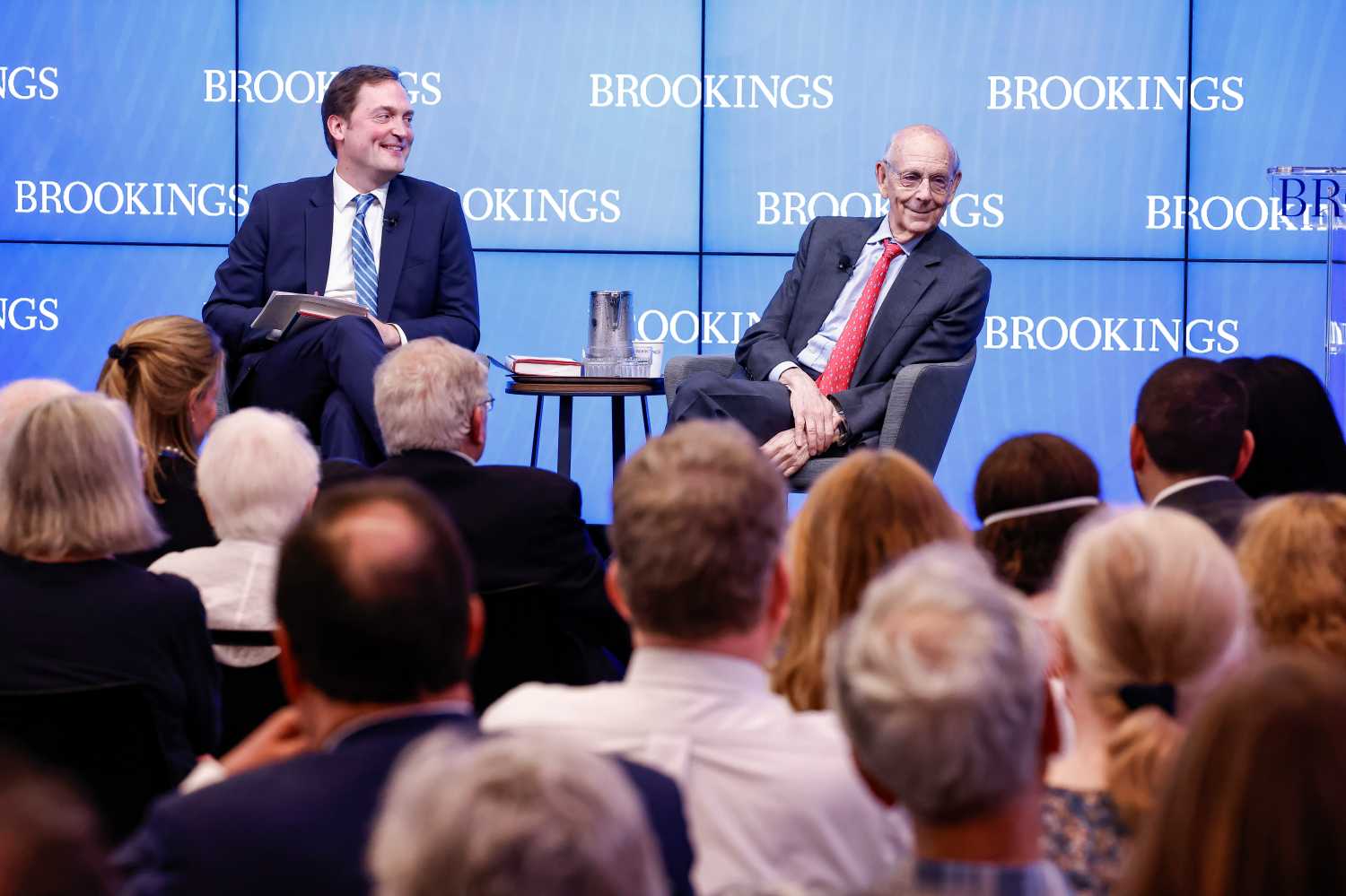 Moderator Brian Richardson and retired U.S. Supreme Court Justice Stephen Breyer share a laugh with the audience at the Initiative’s launch event.