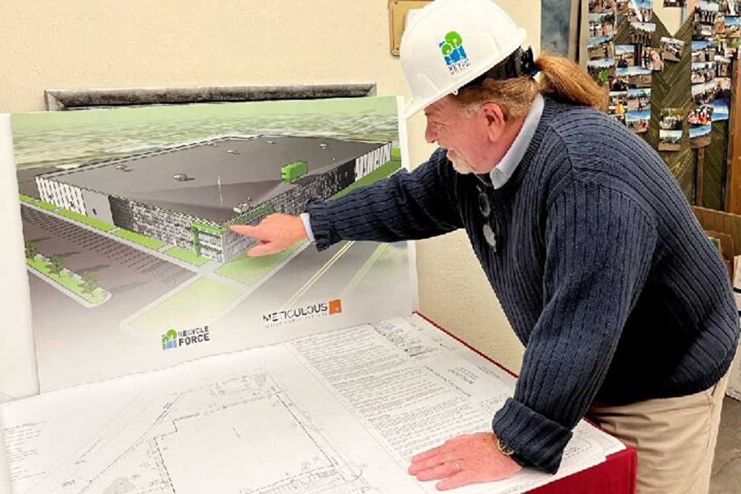 The president of RecycleForce looks at plans for a new facility in Sherman Park