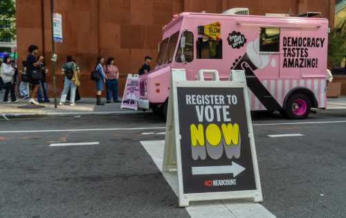 NYU students and other passers-by celebrate National Voter Registration Day by registering to vote outside of New York University, September 17, 2024. The fair was sponsored by Headcount and NYU. (Photo by Richard B. Levine)