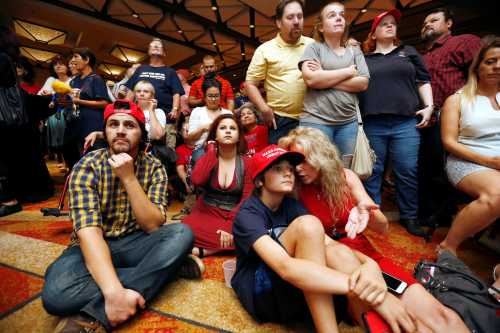 People watch as results from the U.S. presidential election come in late into the night at a Republican Party event in Phoenix, Arizona, November 8, 2016.