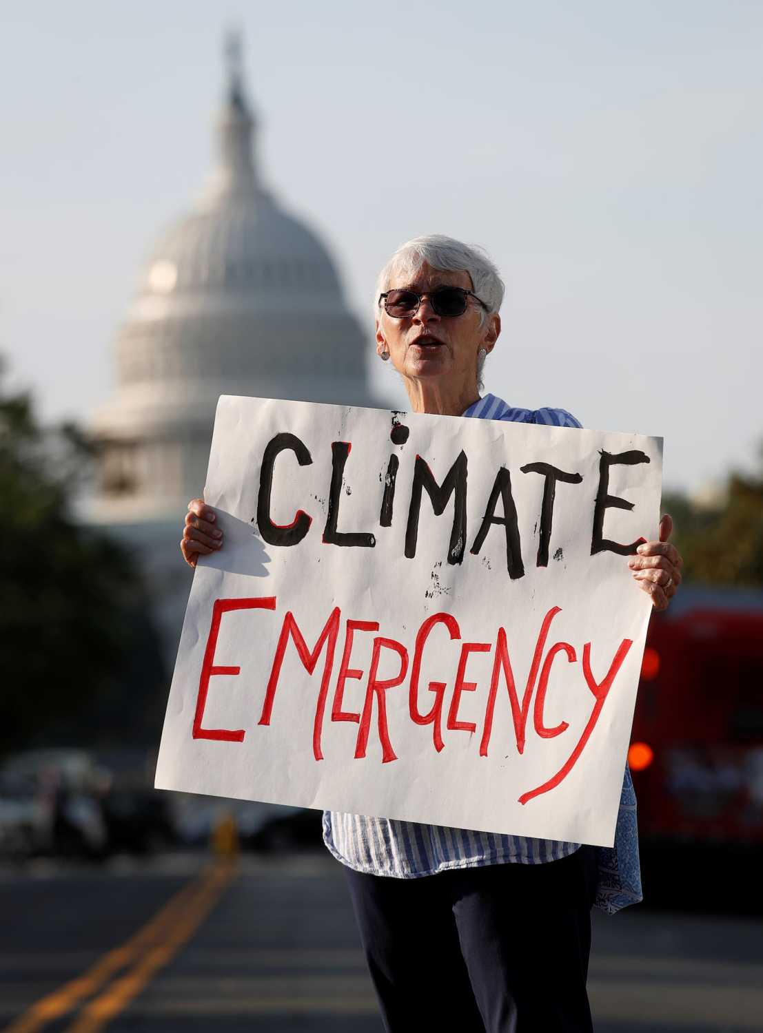 Environmental activists block traffic as part of "Shut Down DC" protests seeking to pressure U.S. politicians to fight climate change in Washington, U.S., September 23, 2019. REUTERS/Kevin Lamarque