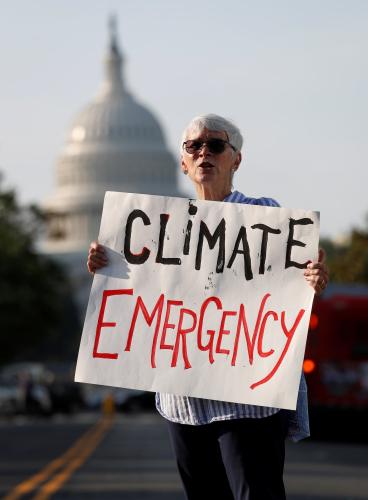 Environmental activists block traffic as part of "Shut Down DC" protests seeking to pressure U.S. politicians to fight climate change in Washington, U.S., September 23, 2019. REUTERS/Kevin Lamarque