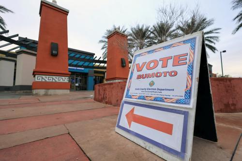 A sign directs voters towards the polling station during the state's Democratic and Republican presidential primary election, held two days before a competing Republican presidential caucus, in Las Vegas, Nevada, U.S. February 6, 2024.