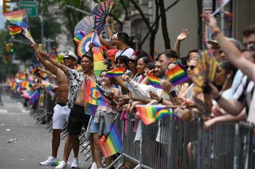 People watch the New York City Pride March along 5th Avenue, New York, NY, June 30, 2024.