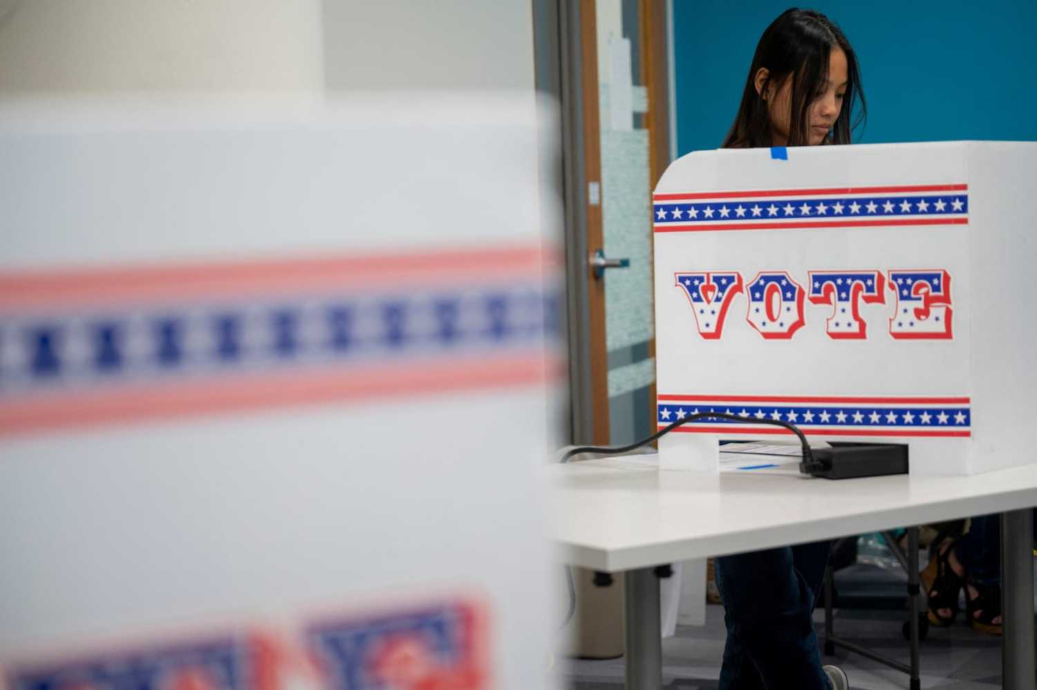 A woman votes on the second day of early voting in Wisconsin at the Milwaukee Area Technical College in Milwaukee, Wisconsin, U.S. October 23, 2024.