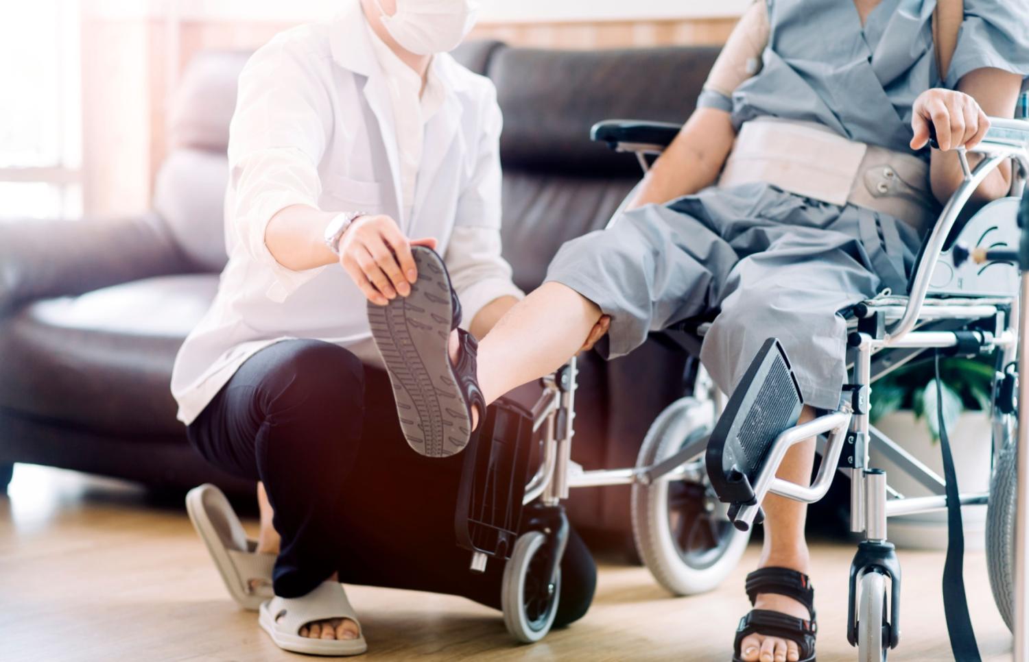 Health care worker with patient in their home.