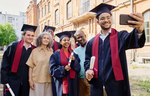 a group of new college graduates posing for a photo with their families