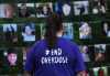 A woman looks at photos of those lost to drug overdoses as many Edmontonians gathered at Victoria Park this evening to mark the annual International Overdose Awareness Day, on August 31, 2023, in Edmonton, Alberta, Canada.