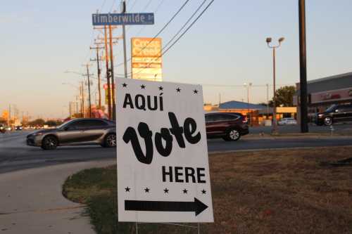 An Aqui Vote Here sign along Grissom road at the Great Northwest Public Library in San Antonio, Texas, USA, on October 21, 2024.