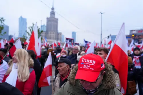 A man wears a hat in support of U.S. President-elect Donald Trump, during the Independence March to mark the 106th anniversary of Polish independence, in Warsaw, Poland November 11, 2024.