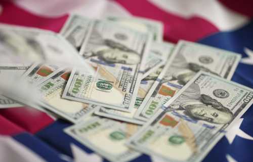 Stack of $100 bills on an American flag