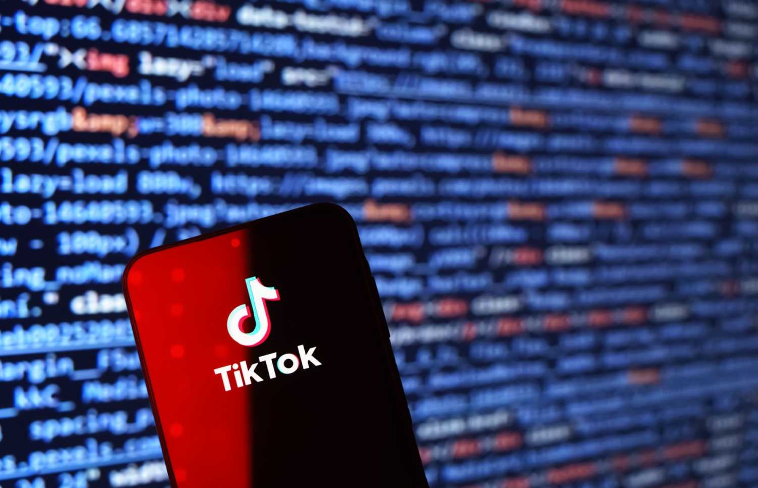 Smartphone on surface showing TikTok logo.