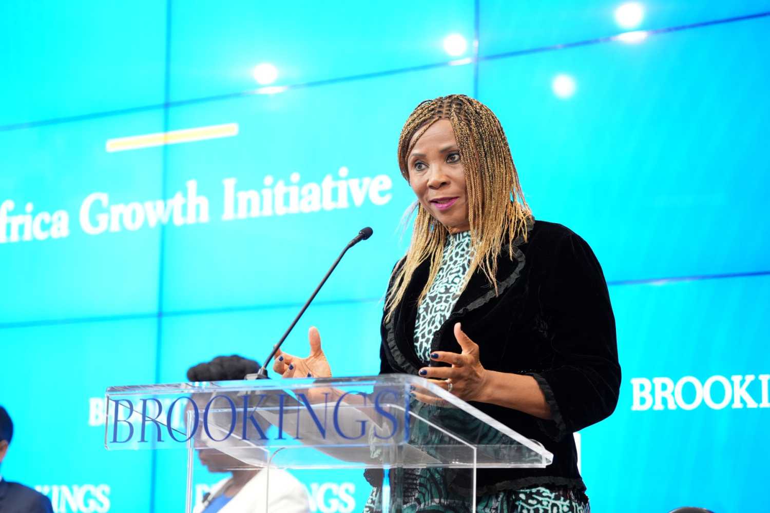 U.N. Assistant Secretary-General Ahunna Eziakonwa speaks from behind a podium