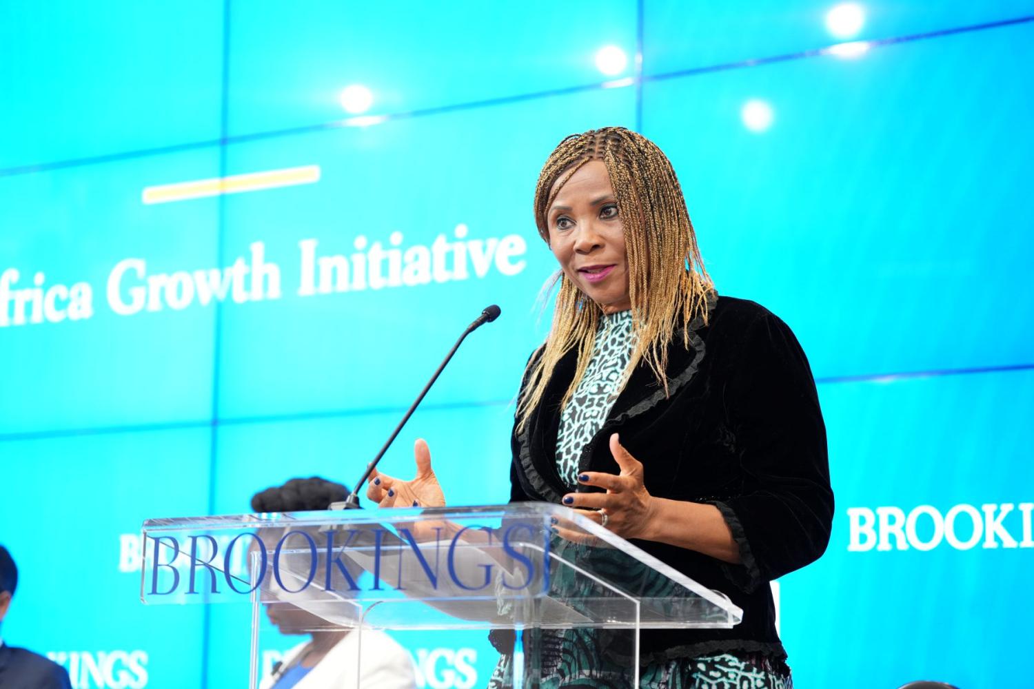 U.N. Assistant Secretary-General Ahunna Eziakonwa speaks from behind a podium