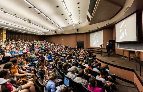 large lecture room packed with college students