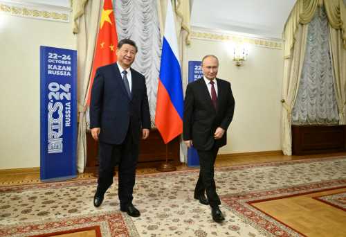 Russian President Vladimir Putin and Chinese President Xi Jinping walk during a meeting on the sidelines of the BRICS Summit in Kazan, Russia October 22, 2024.
