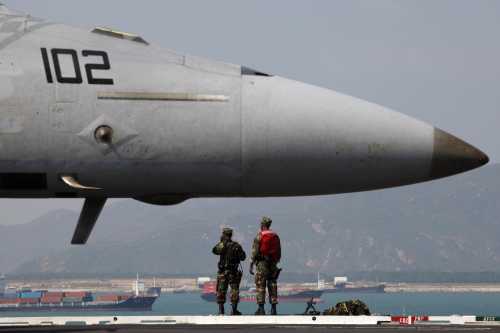 U.S. Marines stand on the deck of U.S. aircraft carrier USS George Washington upon its arrival in Hong Kong October 29, 2009.