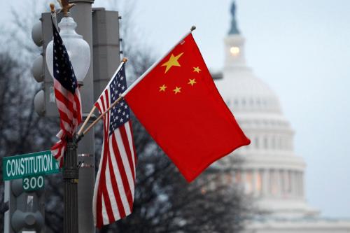 The People's Republic of China flag and the U.S. Stars and Stripes fly on a lamp post along Pennsylvania Avenue near the U.S. Capitol in Washington during Chinese President Hu Jintao's state visit, January 18, 2011.