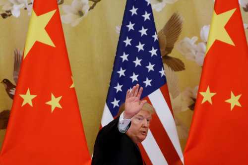 U.S. President Donald Trump waves during joint statements with China's President Xi Jinping at the Great Hall of the People in Beijing, China, November 9, 2017.