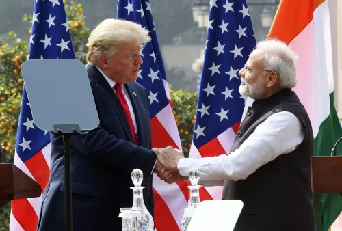 Prime Minister Narendra Modi shakes hand with US President Donald Trump during the joint press statement, at Hyderabad House in New Delhi.