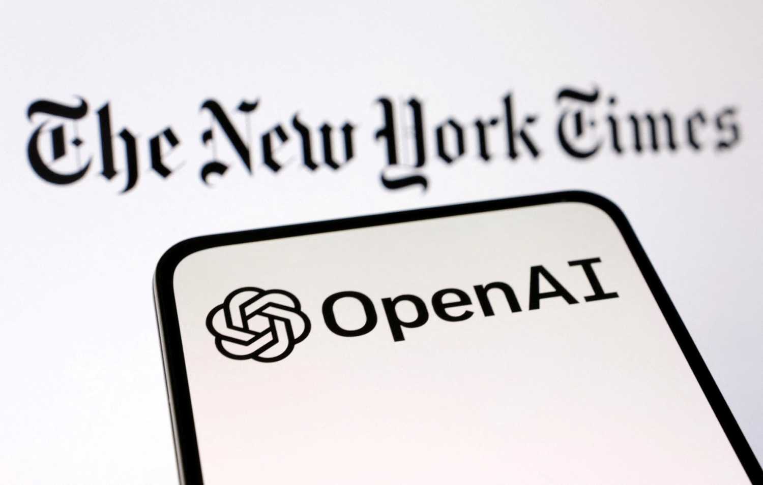 OpenAI and The New York Times logos are seen in this illustration taken on December 27, 2023.