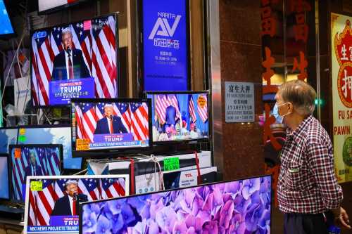 News of the Donald Trump's winning the US presidential election is broadcasted on TV screen in a shop in Sham Shui Po.