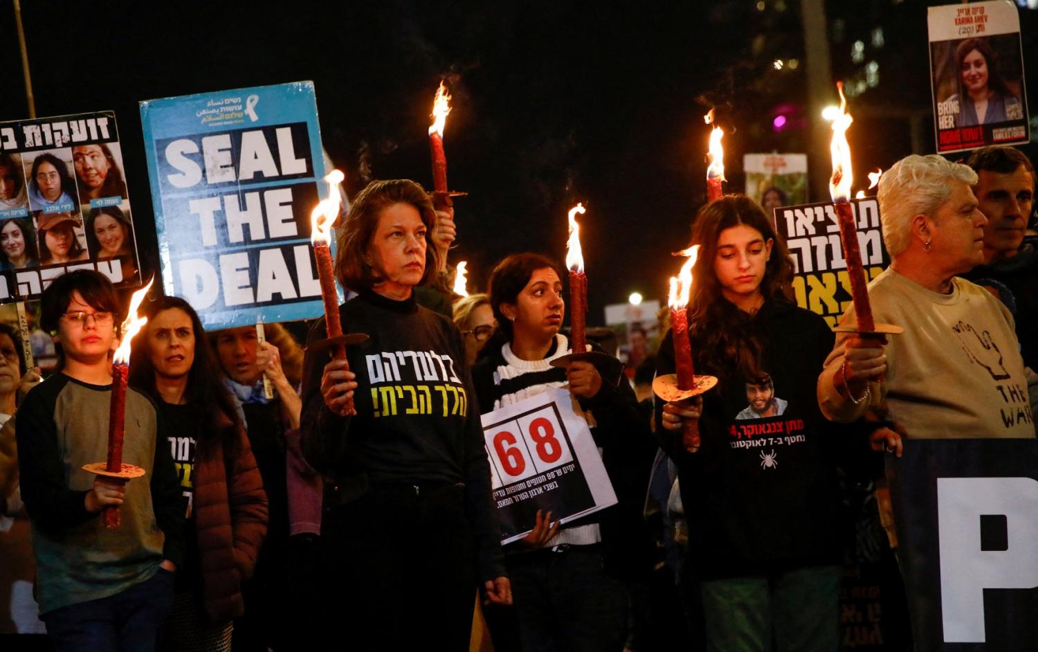 Supporters and family members of hostages kidnapped during the deadly October 7, 2023, attack on Israel by Hamas, hold lit up torches during a protest ahead of a ceasefire between Israel and Hamas, in Tel Aviv, Israel, January 16, 2025.