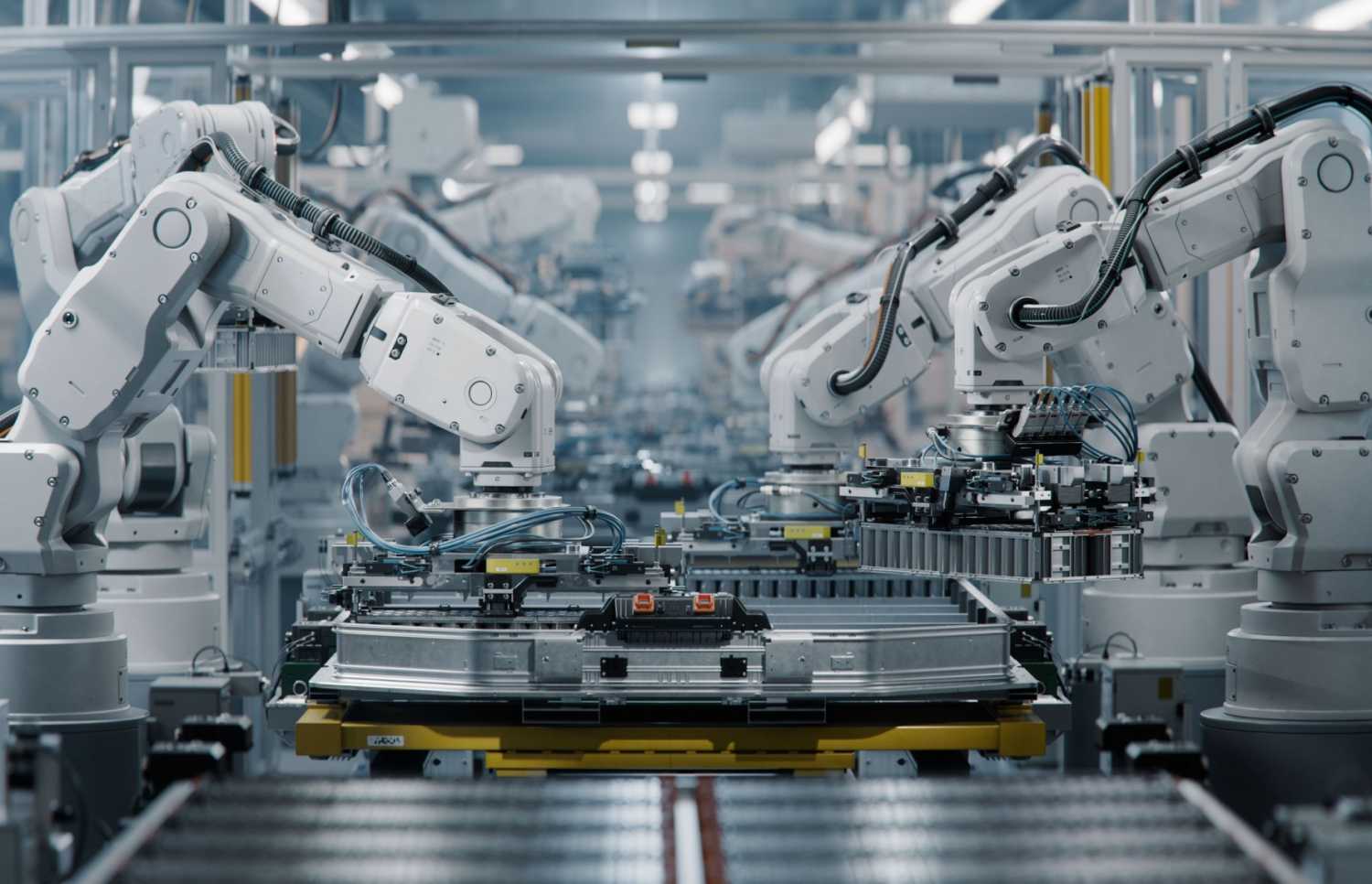 Row of White Robotic Arms at Modern Factory