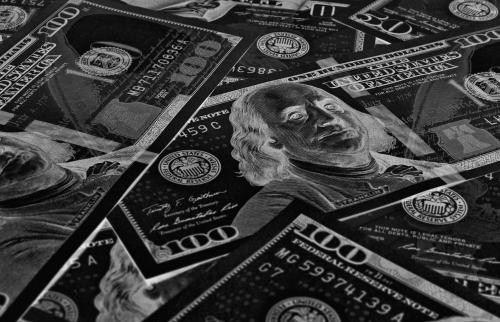 Negative colored image of 100 dollar bills