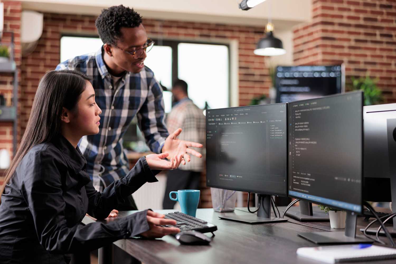 Multiethnic software engineering team developing software algorithm for information processing and network optimization.