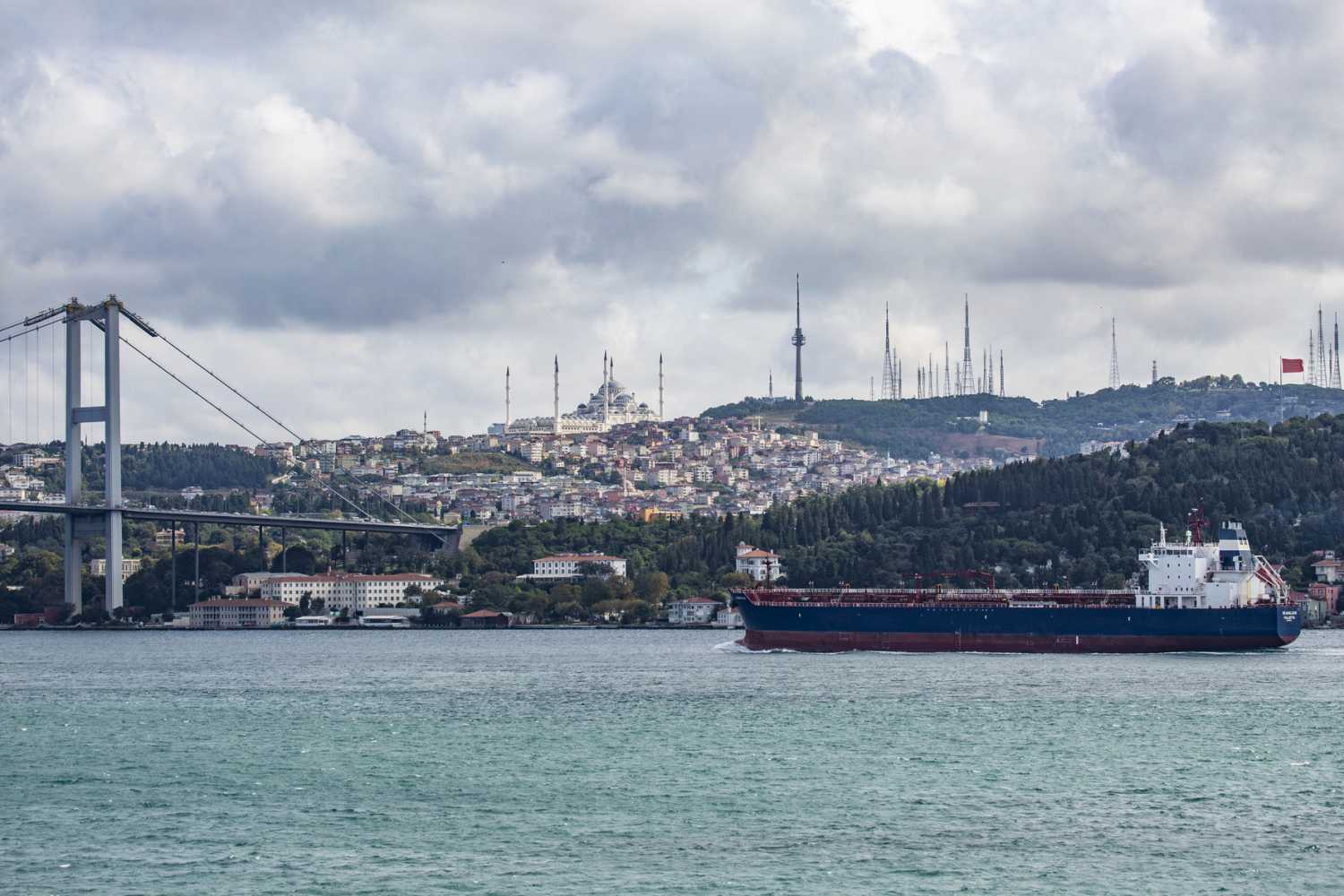 Freighters cross the Bosporus strait, a narrow natural strait and an internationally significant waterway located in northwestern Turkey, in Istanbul.