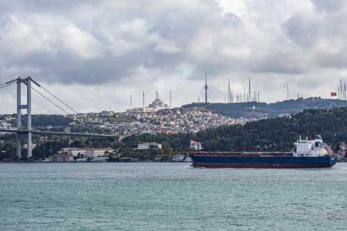 Freighters cross the Bosporus strait, a narrow natural strait and an internationally significant waterway located in northwestern Turkey, in Istanbul.