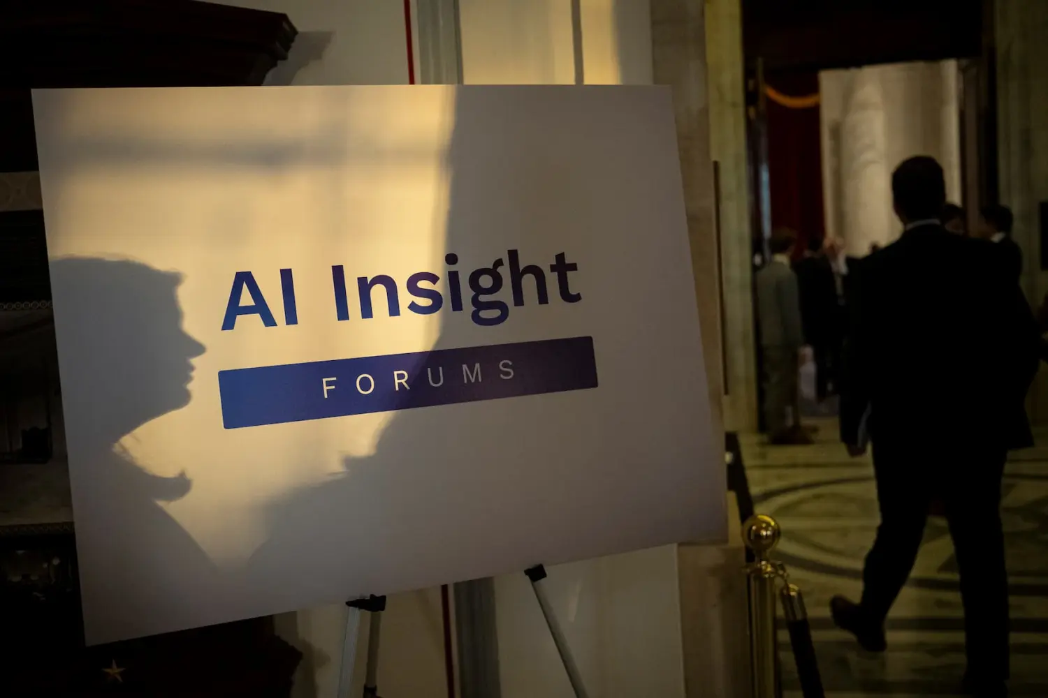 A sign for the Senate Artificial Intelligence Insight Forums is seen illuminated by sunlight outside the meeting room where experts gathered with lawmakers, at the U.S. Capitol, in Washington, D.C., on Tuesday, October 24, 2023.