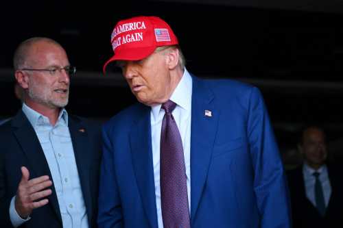 U.S. President-elect Donald Trump speaks to Brendan Carr, his intended pick for Chairman of the Federal Communications Commission, as he attends a viewing of the launch of the sixth test flight of the SpaceX Starship rocket, in Brownsville, Texas, U.S., November 19, 2024.